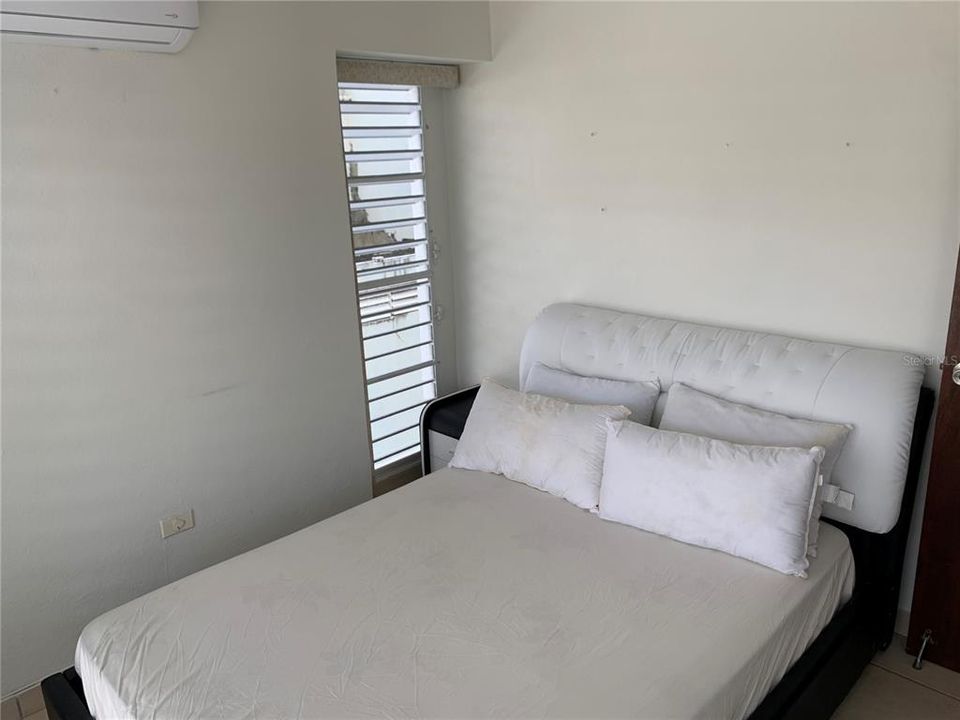 Third bedroom with full size bed and AC