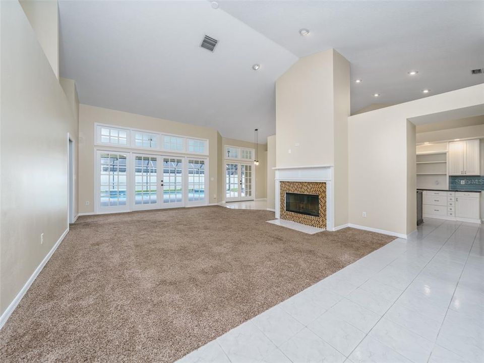 Living room overlooking lanai and pool.