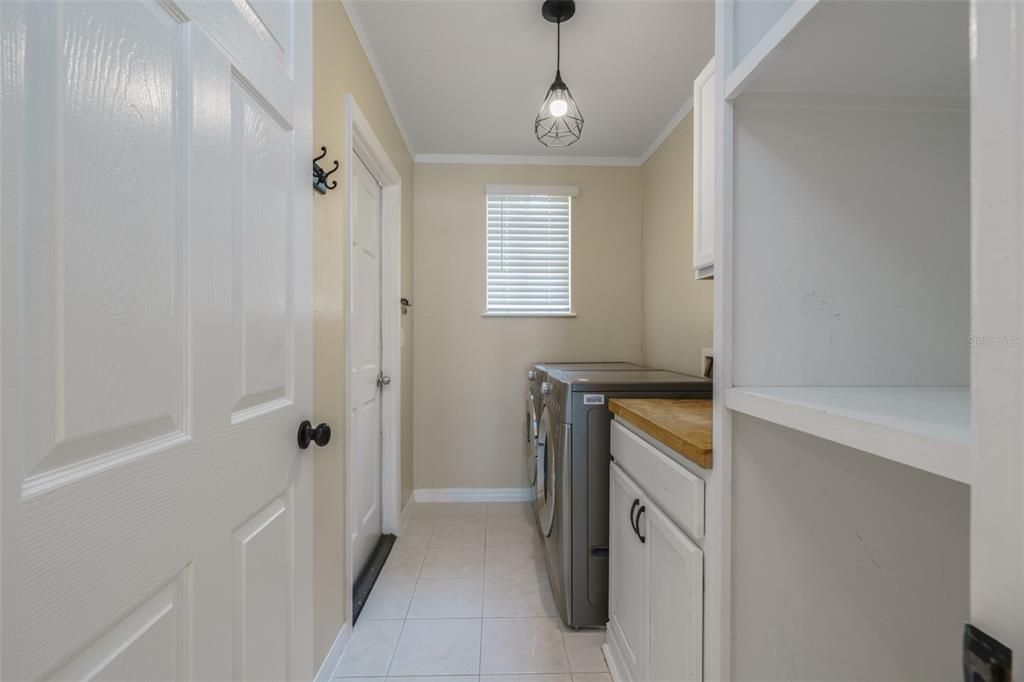 Laundry Room off of kitchen with door to the garage.