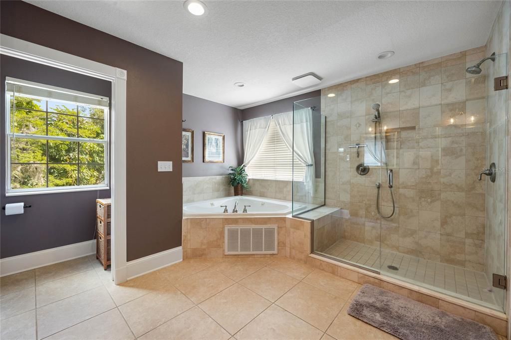 primary bedroom ensuite w/ jacuzzie tub & tile shower