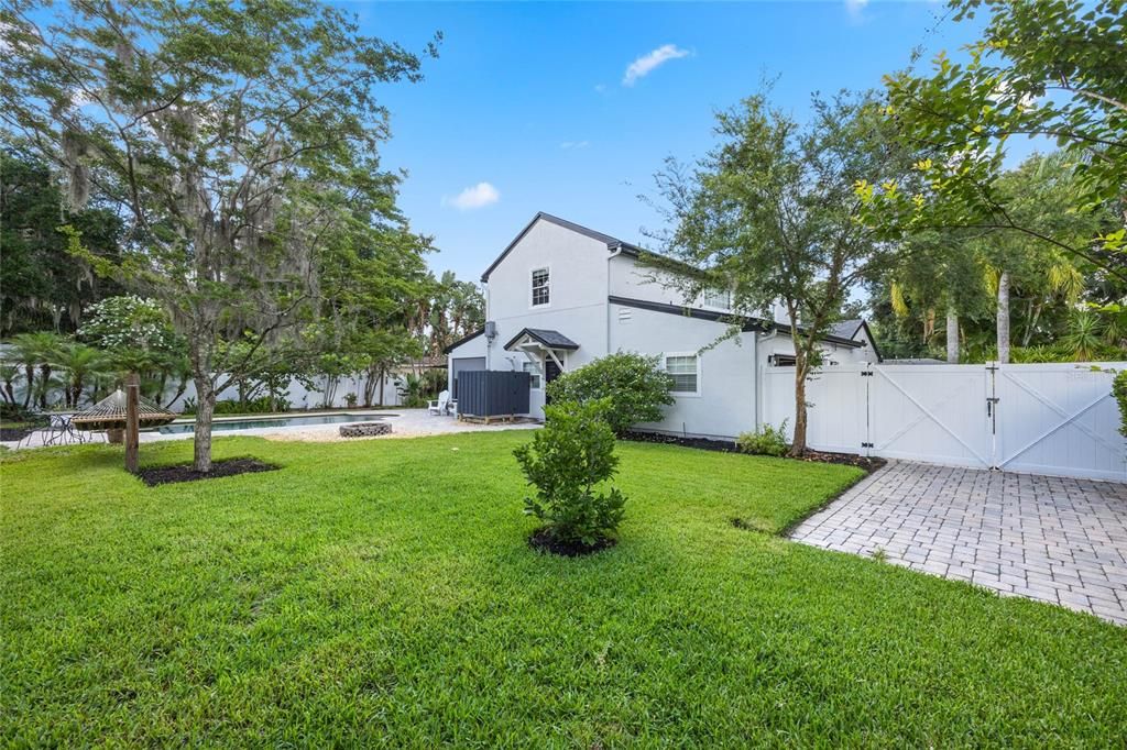 backyard w/ additional parking pad behind gates