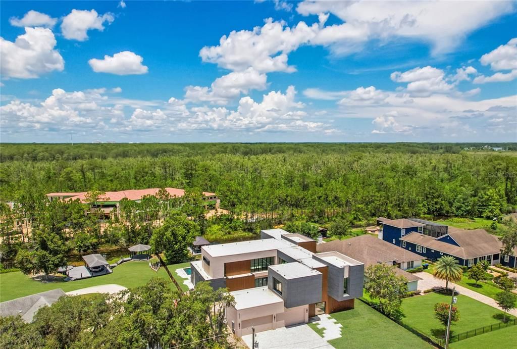 Welcome to 10424 Pocket Ln, Orlando, FL 32836Redefining luxury, with sleek lines, opulent finishes, and cutting-edge smart home technology**Estimated completion September/ October 2024. Picture virtually enhanced depicting home with grass in place