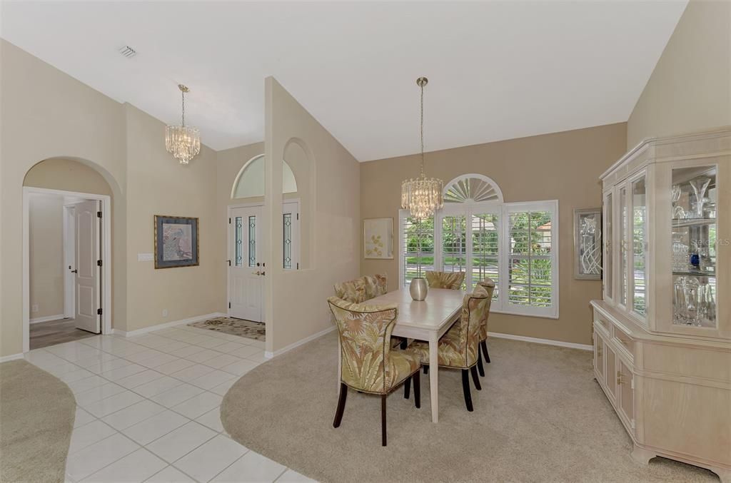 plantation shutters and a gorgeous chandelier(s)