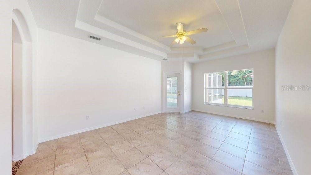 Master with tray ceiling and door to lanai