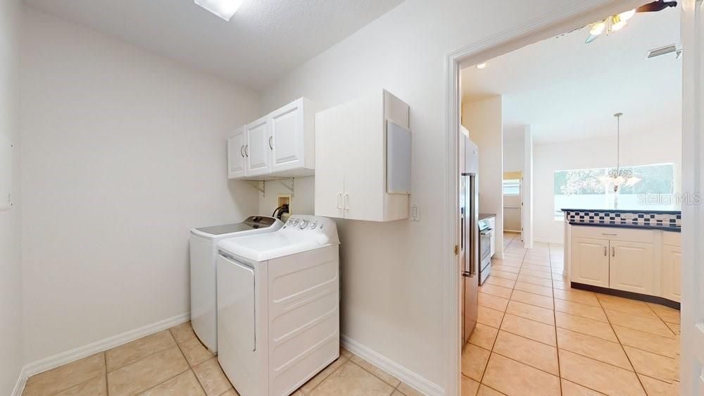 Master with tray ceiling and door to lanai