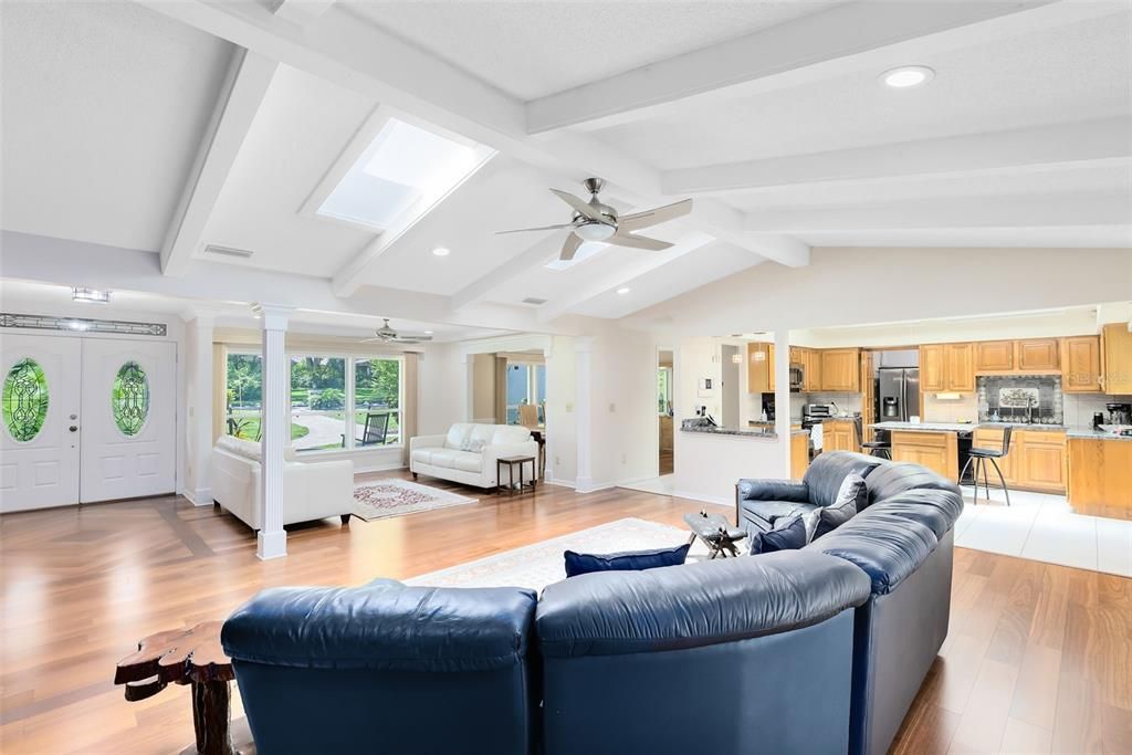 Natural light floods in through the skylights, illuminating the room with a warm and inviting glow throughout the day.