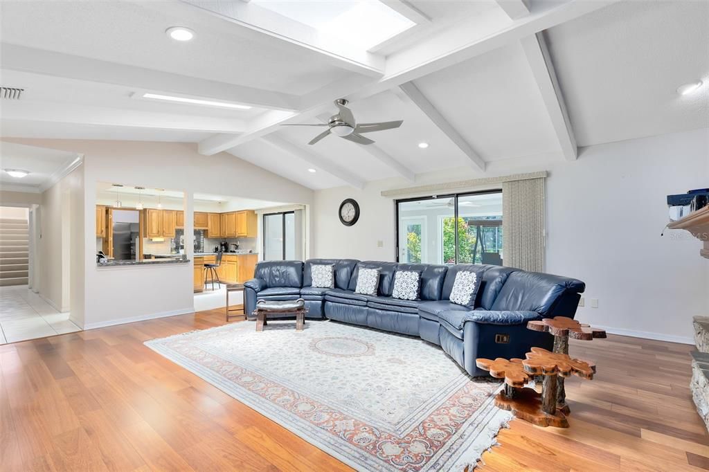 Your spacious family room features a stunning vaulted ceiling, giving an open and airy feel to the space.