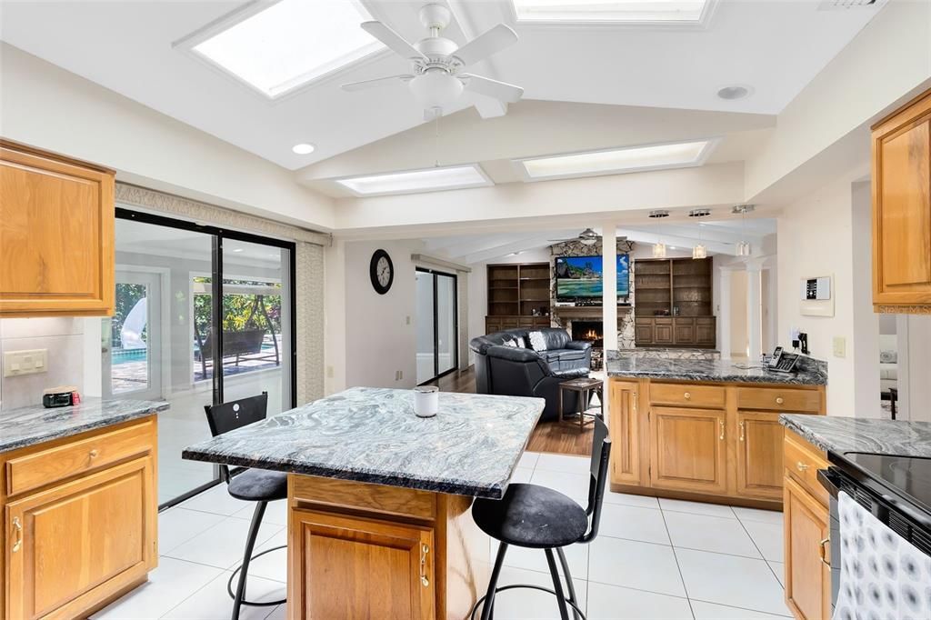 Ample, solid surface counter space, an island and modern appliances make meal preparation a breeze.