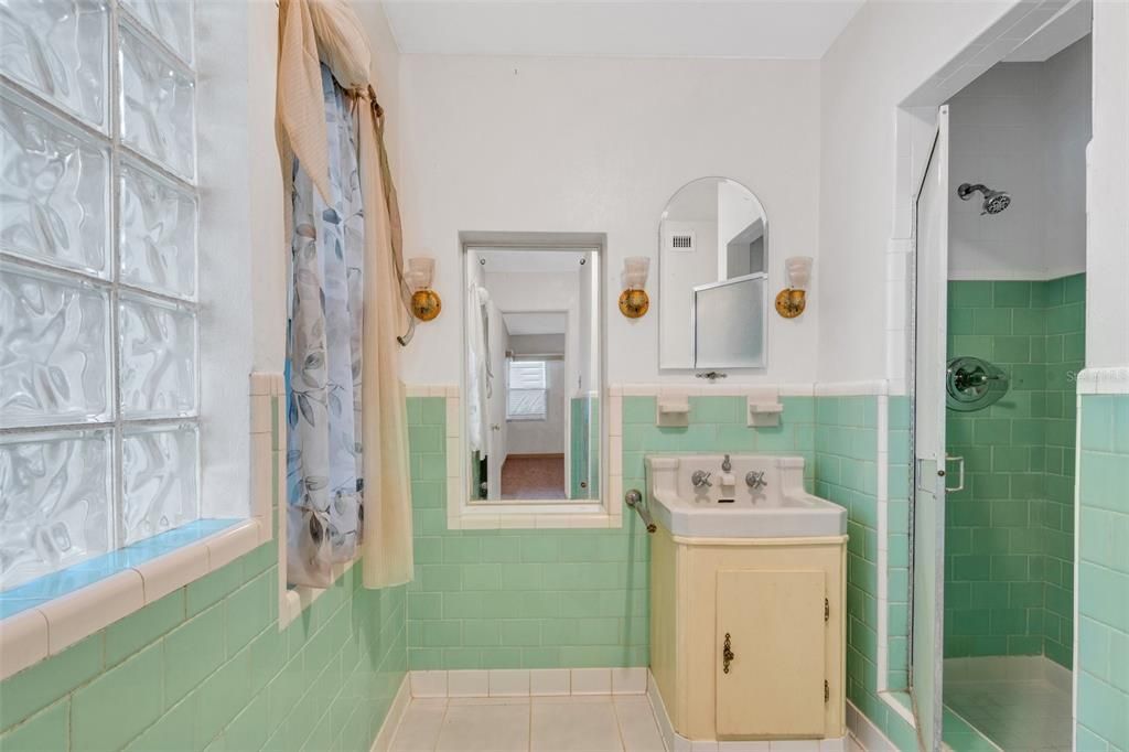 and ensuite bathroom complete with original Art Deco tile . . .