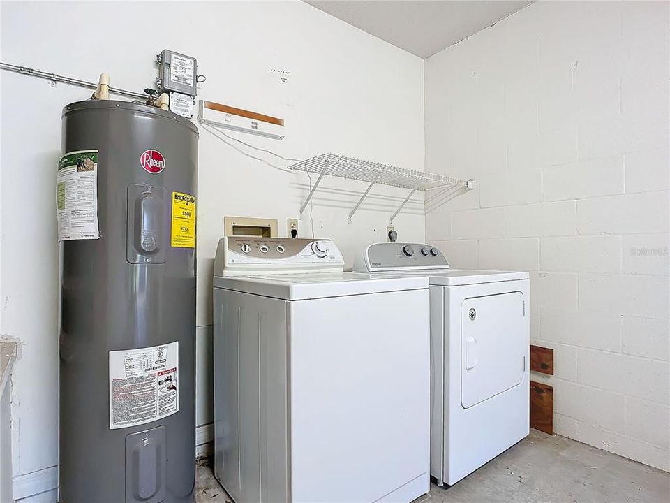 Hotwater heater and Washer and Dryer in Garage