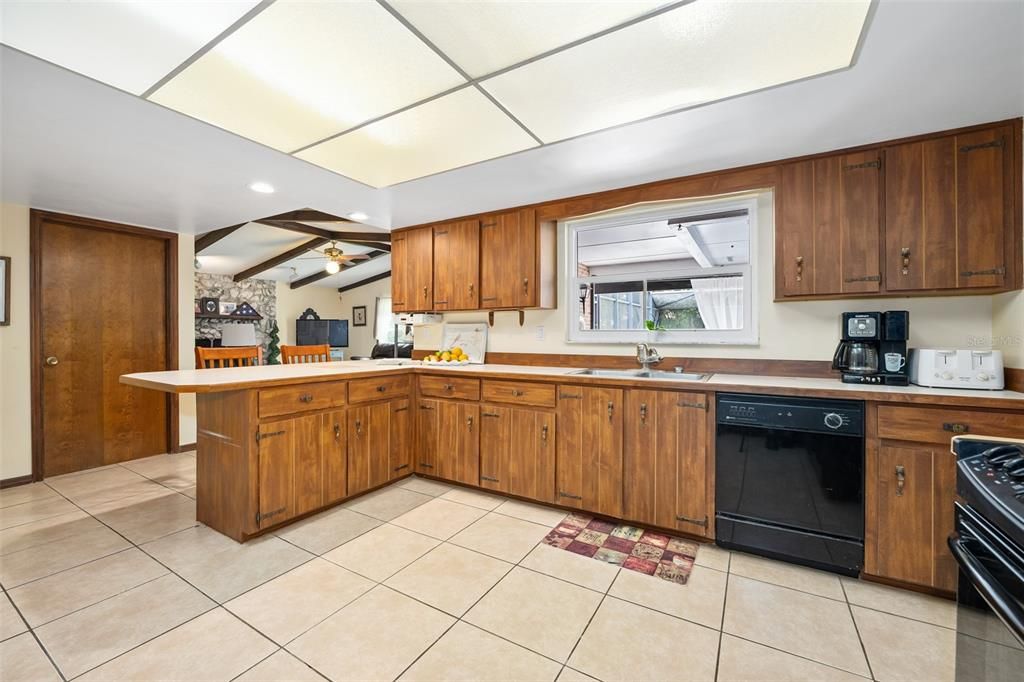 Kitchen in center of the home with window to the lanai