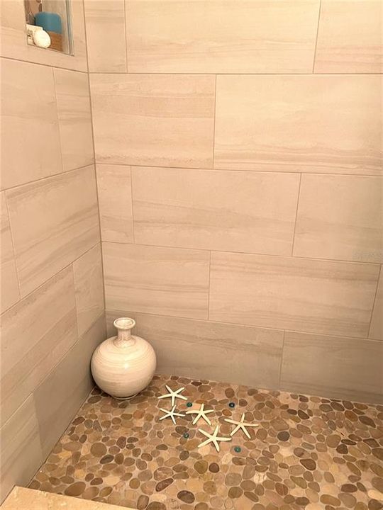 Pebbled Shower In The Guest Bathroom