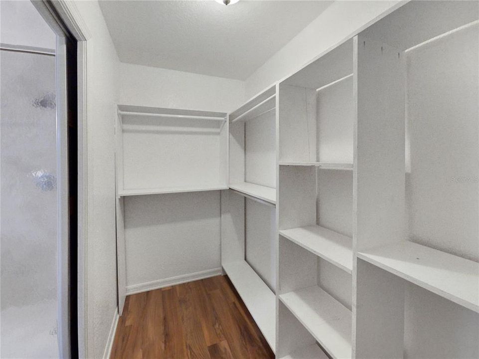 Primary Walk in Closet with built in storage