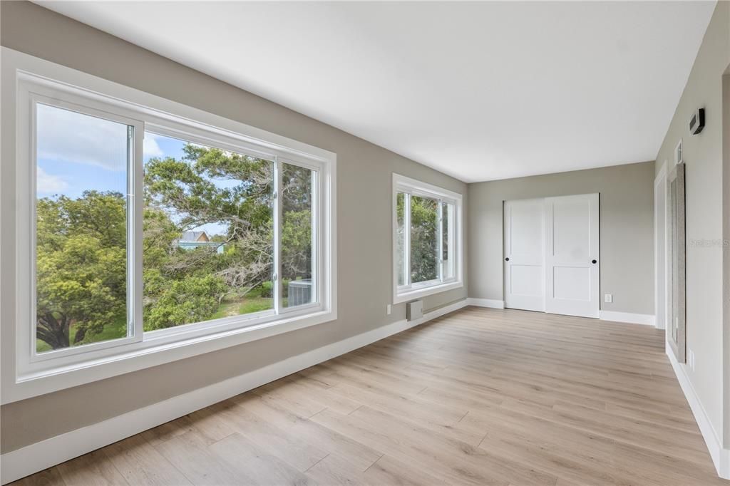 view of the bonus room with a large storage closet