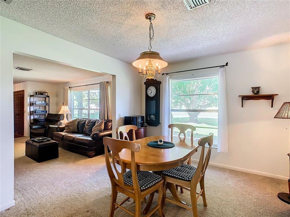 Formal dining room is just off the kitchen and close to the formal living room.