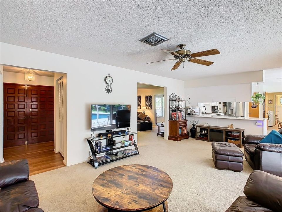 The family room opens to the foyer,  the living room and kitchen.