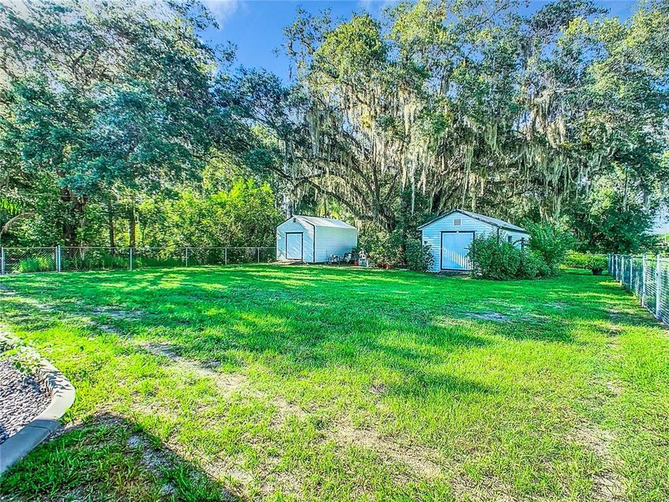 2 sheds are located in the fenced in yard.