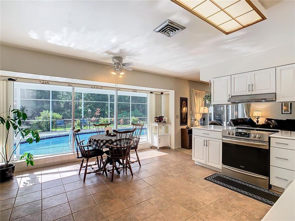 A view of your backyard retreat thru the large picture window by the dinette.