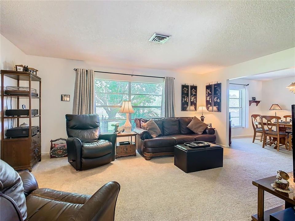 Large windows in the formal living room and dining room.