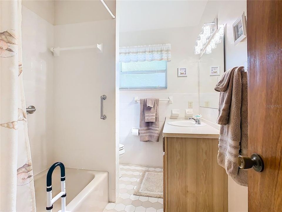 Guest bath has tub/shower combination.
