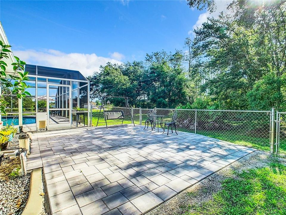 An additional fenced sitting area with pavers allows plenty of room to enjoy the outdoors space.