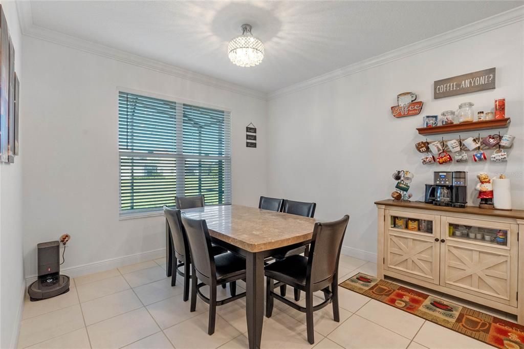Convenient dining space seamlessly connected to the gourmet kitchen and cozy living room, perfect for easy entertaining.
