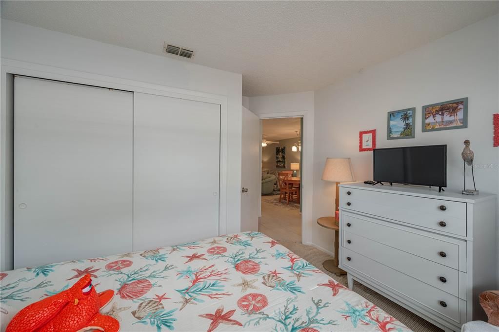 Guest bedroom is spacious.  This is looking out to the hallway.