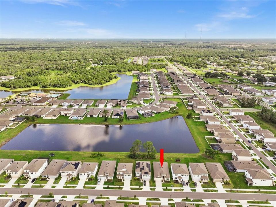 Aerial and Water View Behind Home