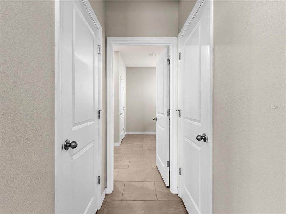 Primary Ensuite Bath featuring Dual Vanity and private Water Closet