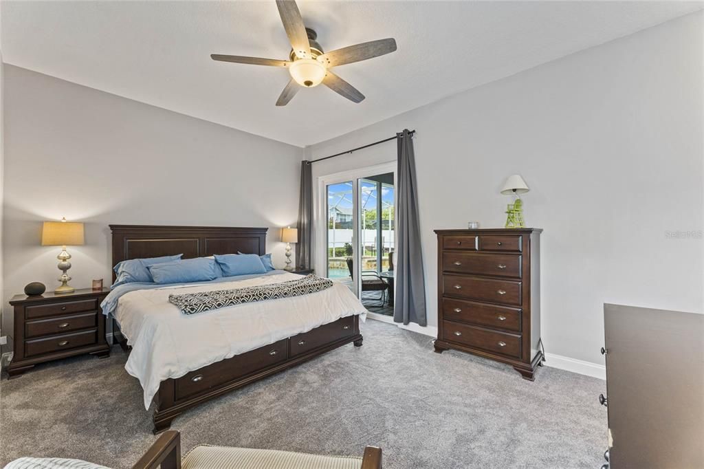 All of the guest bedrooms can be found on one side of the home with access to the renovated hall bath while the OWNER’S SUITE is tucked away on the other side creating a tranquil retreat with direct access to the lanai/pool, a 10x9 WALK-IN CLOSET and a private en-suite bath!