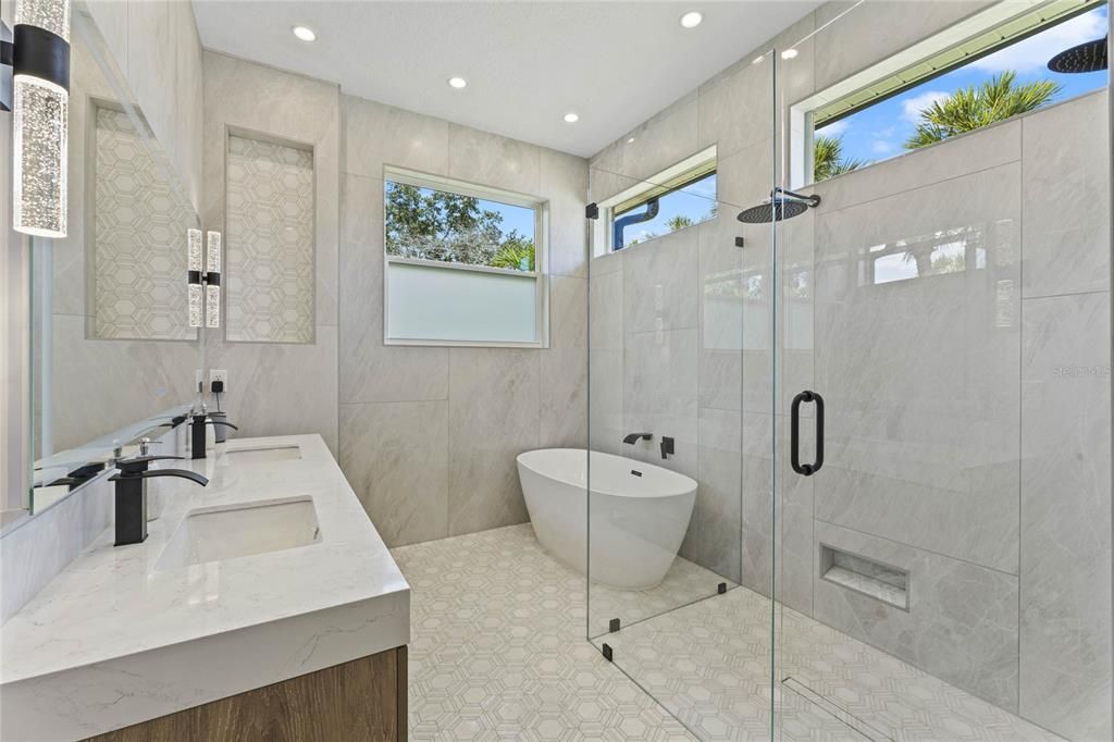 Your private en-suite bath was crafted to be functional in the layout and luxurious in the exquisite marble finishes.