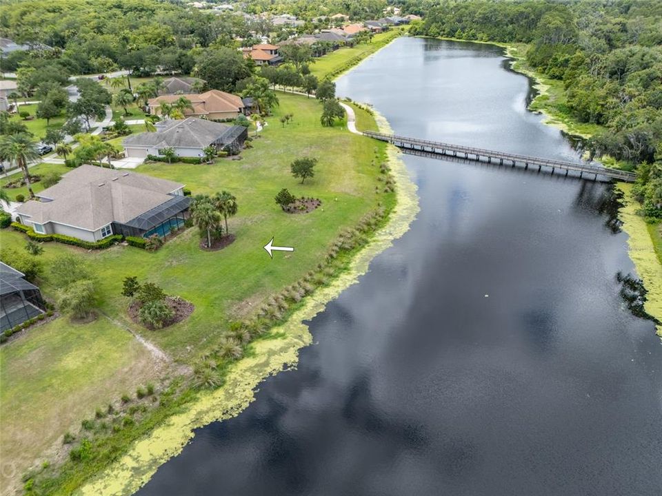 Ariel view of property, water & walking bridge