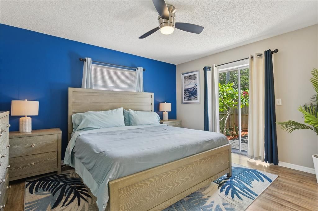 Primary bedroom with large walk-in closet and ensure bathroom