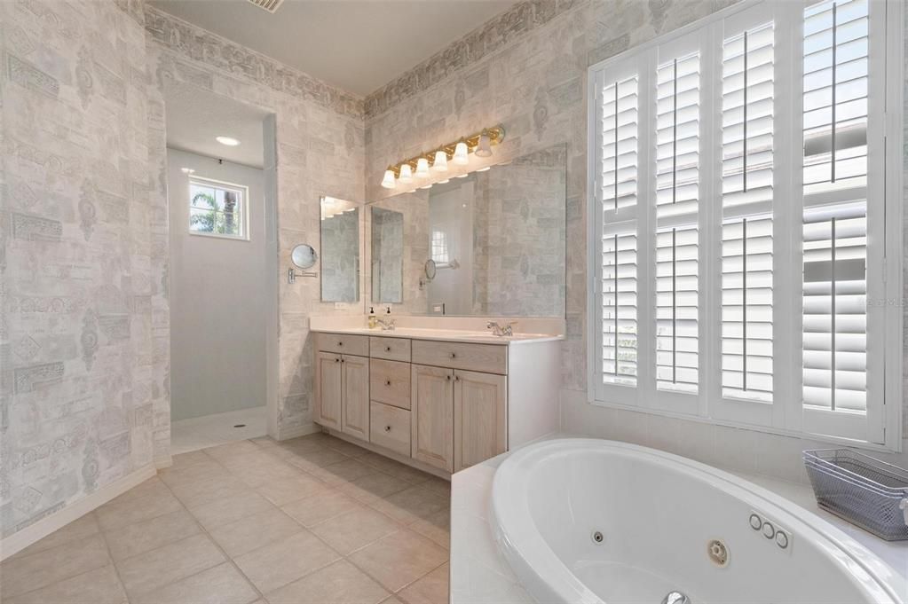 Primary bathroom with Roman shower and Jacuzzi bath