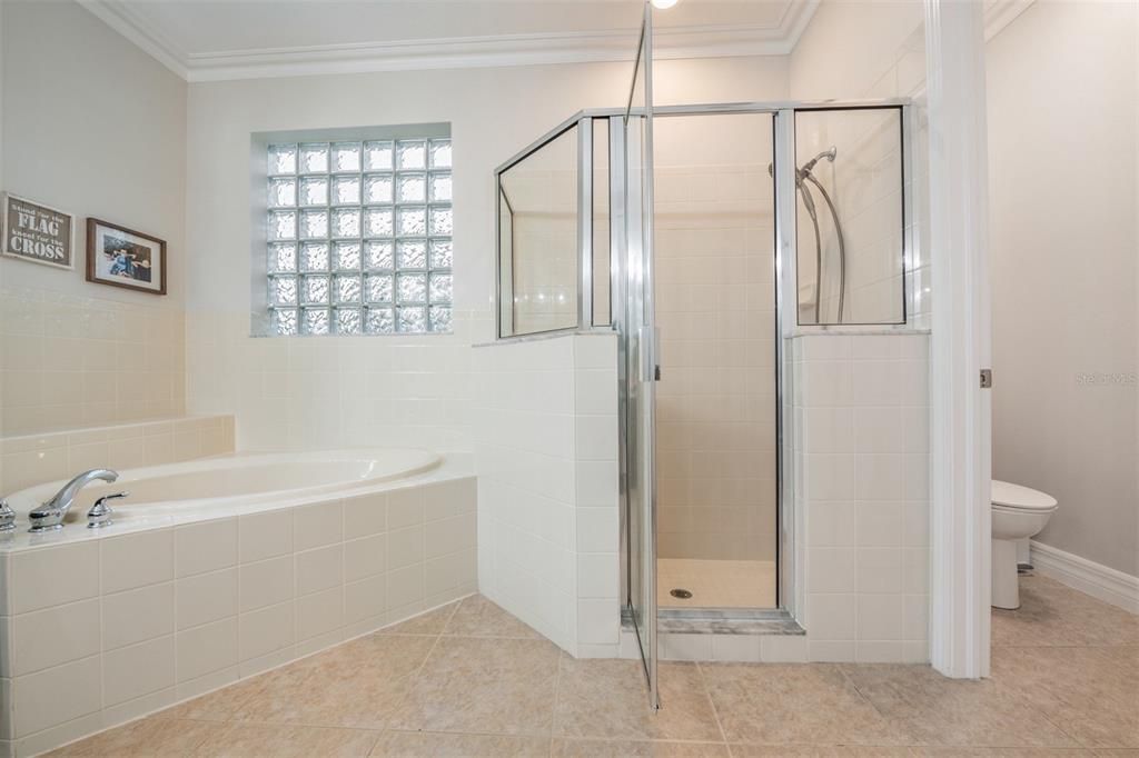 Primary walk-in shower and soaker tub