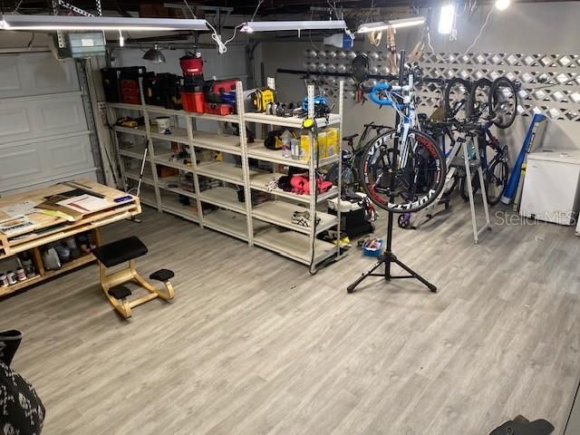The garage has a laminated floor