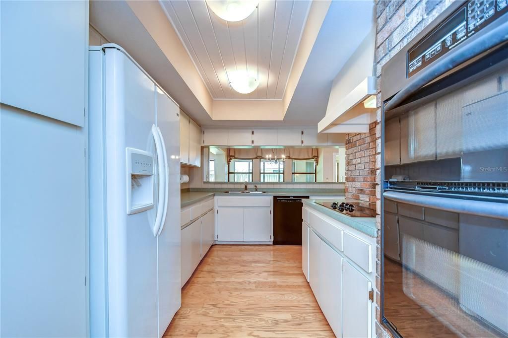 Spacious breakfast nook with a charming window bench that doubles as extra storage!