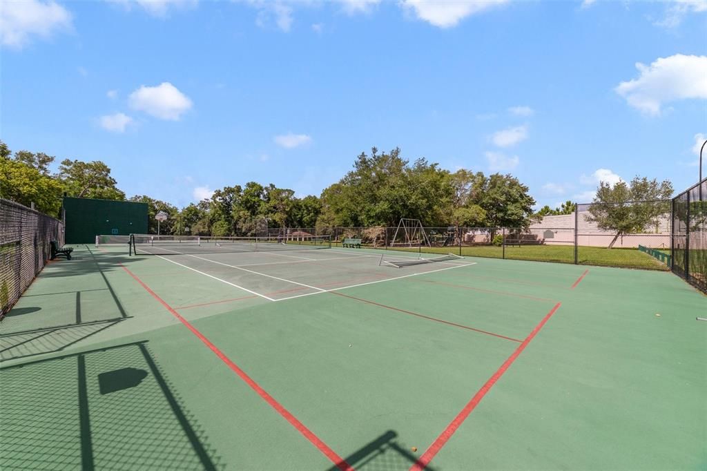 The over half an acre lot includes a fenced backyard where you can spend the Summer poolside and the mature trees around the perimeter add privacy.