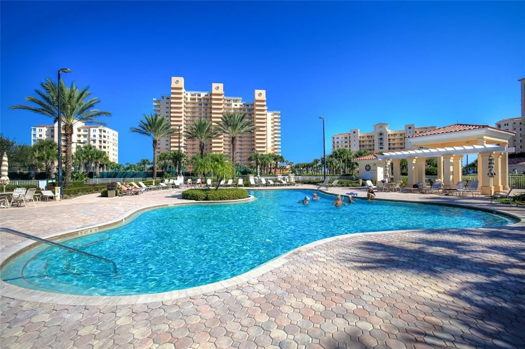 Minorca community pool and spa with Inlet in background