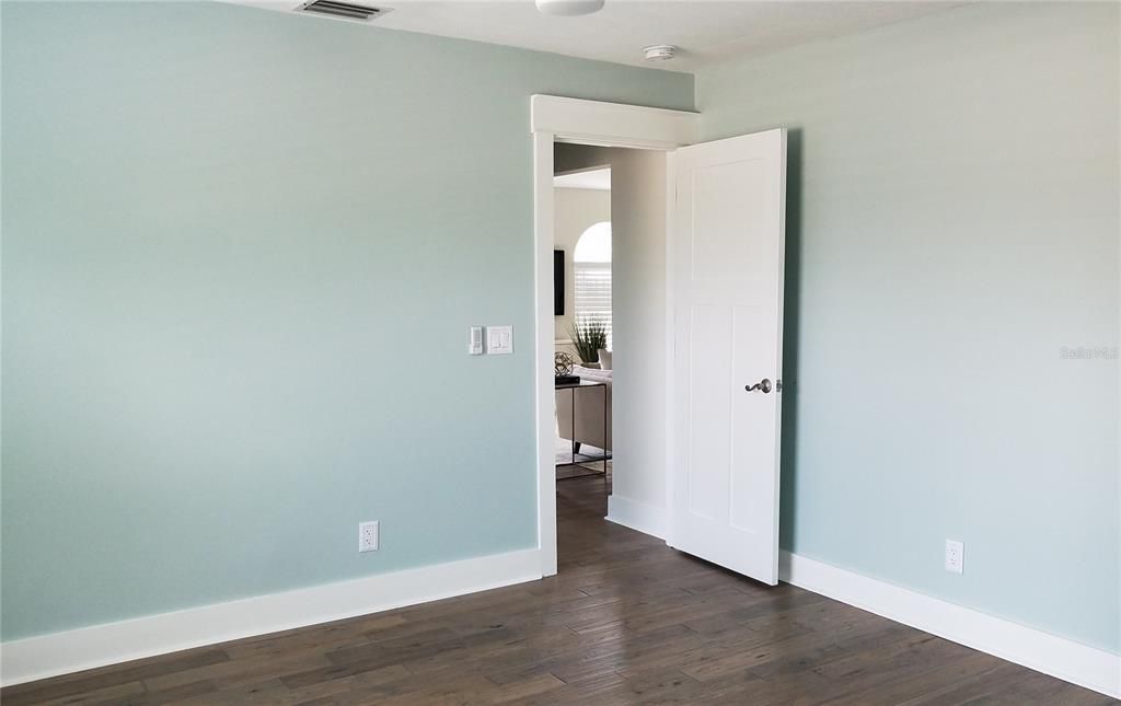 3rd bedroom with barn door on walk-in closet