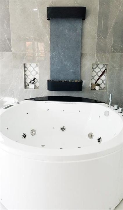 Primary bath- Luxurious Spa Tub with Waterfall feature