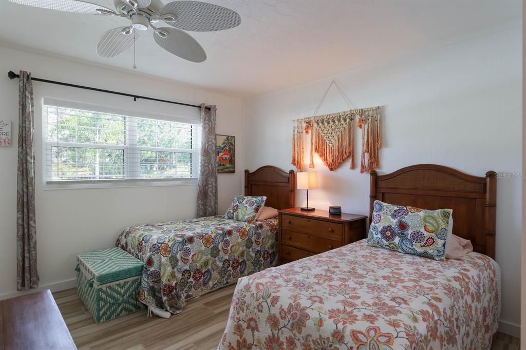 The 3rd bedroom currently accommodates two twin beds, a dresser and a chest of drawers.