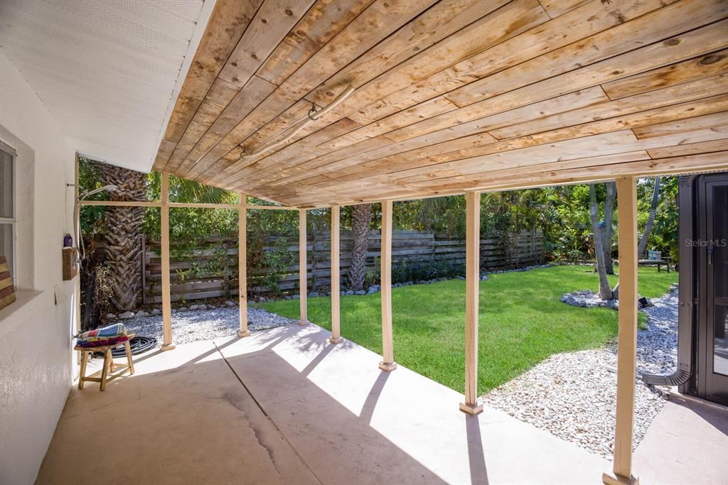 This additional covered patio offers the perfect place to clean up after a day on the boat or at the beach, equipped with an outdoor shower.