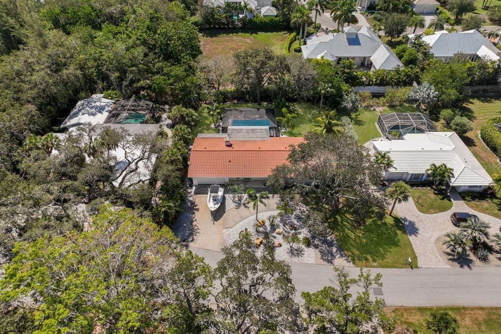 Aerial of the home - featuring a tile roof.