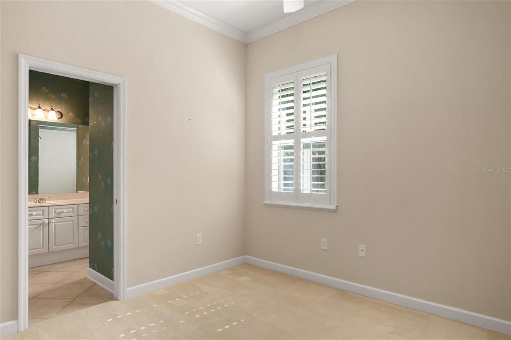 Guest bedroom with adjoining bathroom.