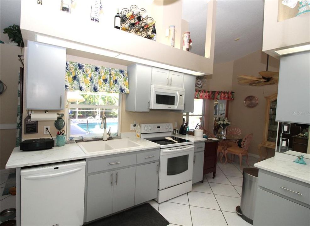 Kitchen nice double sink with pass through window out to the breakfast bar in the lanai...