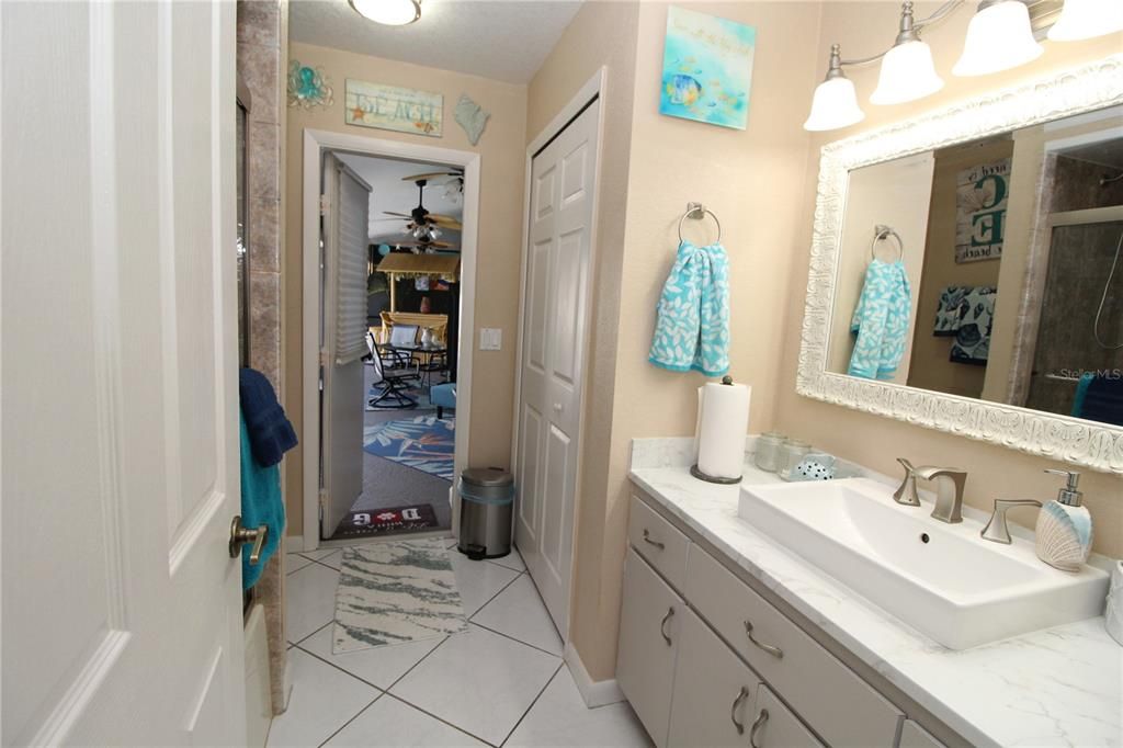 Guest Bathroom- One sink vanity... tub/shower.....linen closet....door out to your private swimming pool...