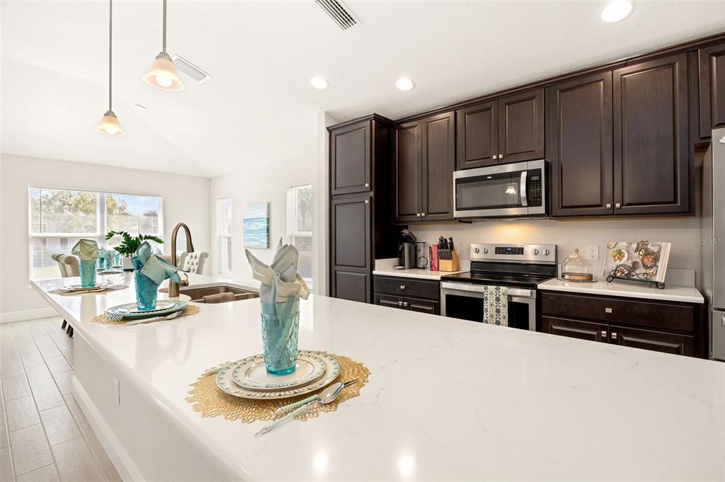 Kitchen With Engineered Quartz Countertops & Stainless Steel Appliances