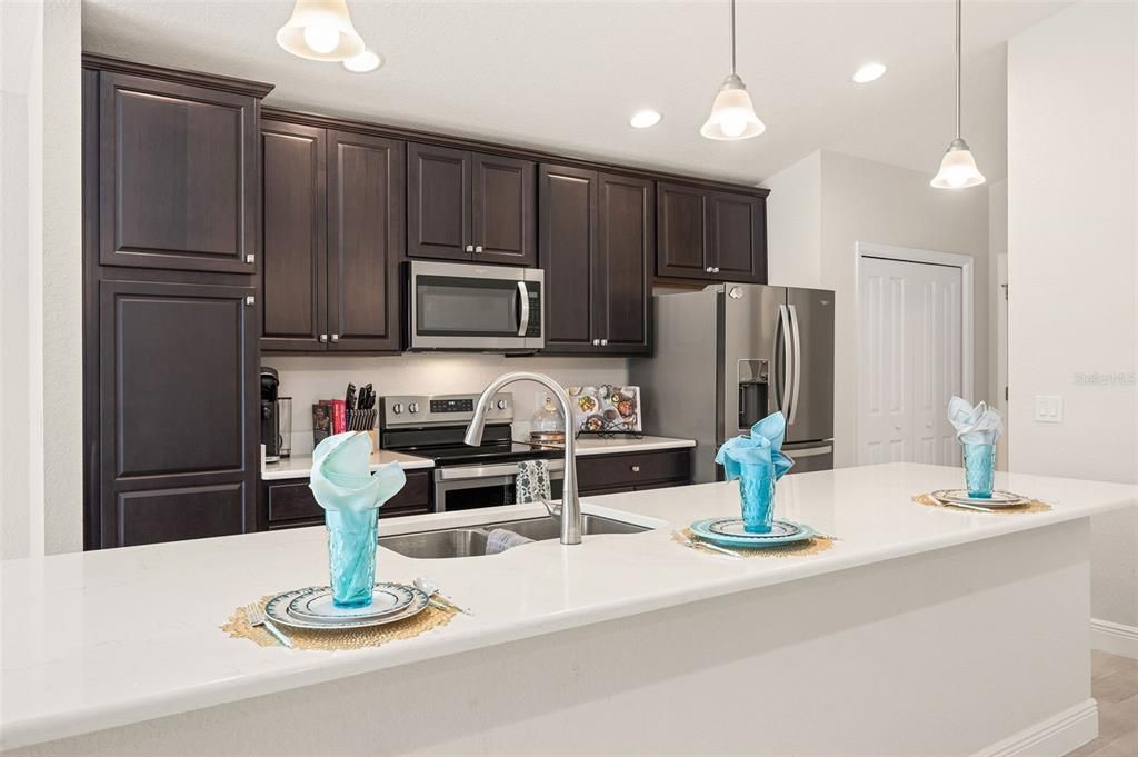 Kitchen With Engineered Quartz Countertops & Stainless Steel Appliances