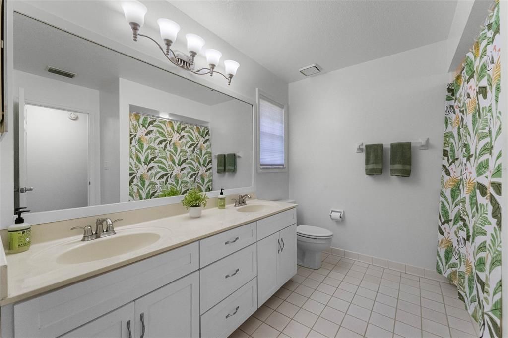 other full bathroom with double sink vanity area